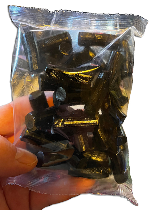 Halve Finnish Soft Licorice in a hand