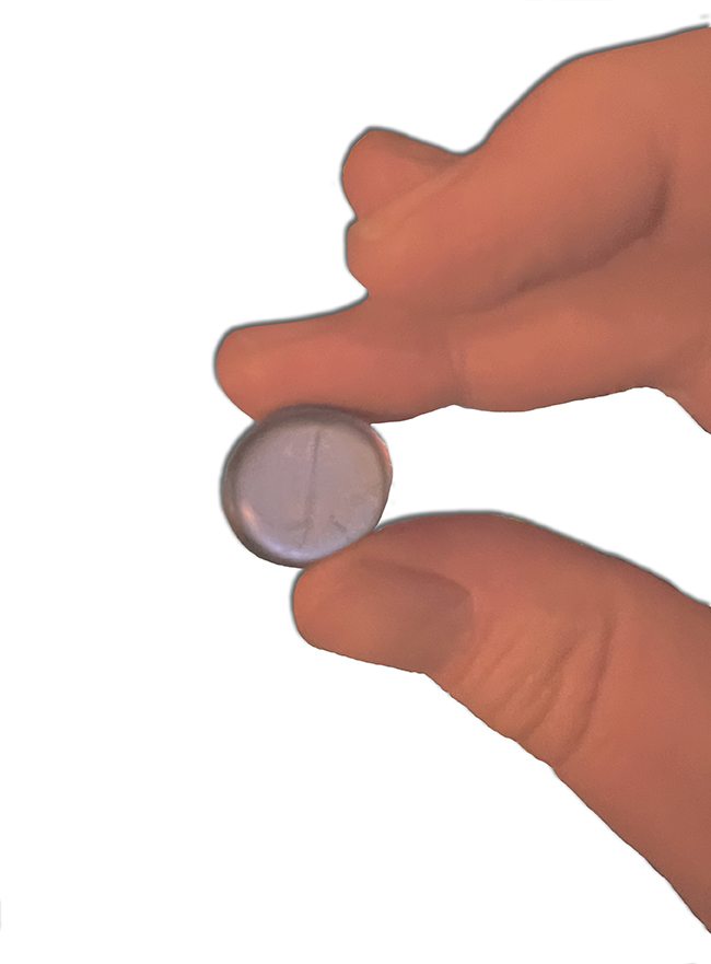 Haribo Air-Drop piece of candy in a hand